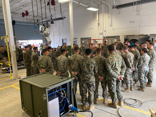 U.S. military servicemen receiving operating instructions for RussKap AWG.